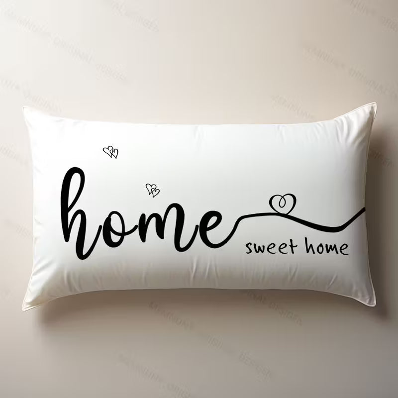 Funda de cojín blanca rectangular de 30x50 cm con la frase Home Sweet Home y detalles de corazones negros.