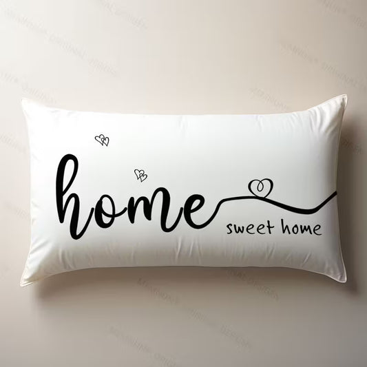 Funda de cojín blanca rectangular de 30x50 cm con la frase Home Sweet Home y detalles de corazones negros.