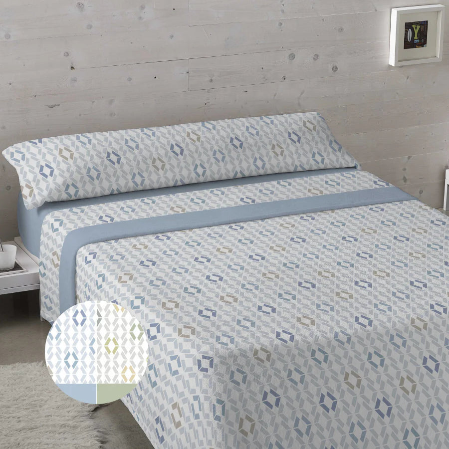 Juego de sábanas de coralina azul para cama de 150cm con estampado geométrico.