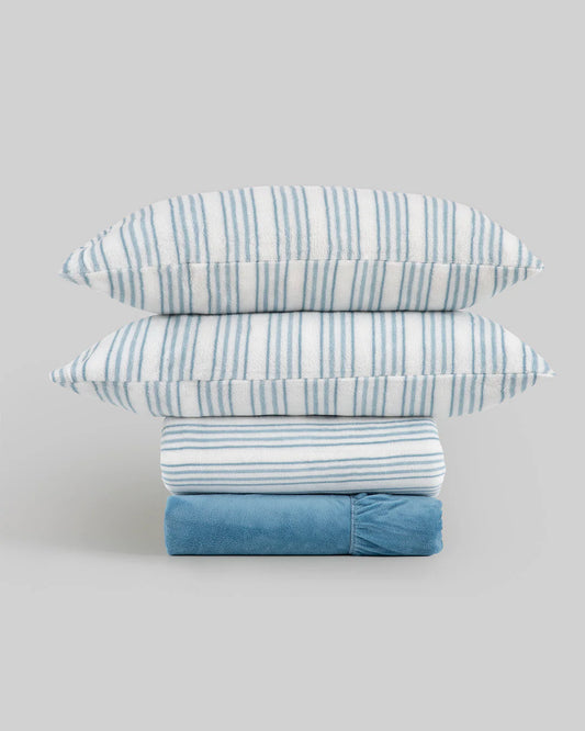 Juego de sábanas de coralina azul con diseño de rayas