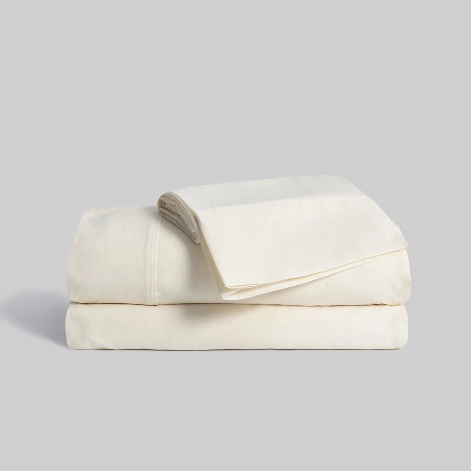 Juego de sábanas color crema liso de tacto suave confeccionado en mezcla de algodón y poliéster para cama