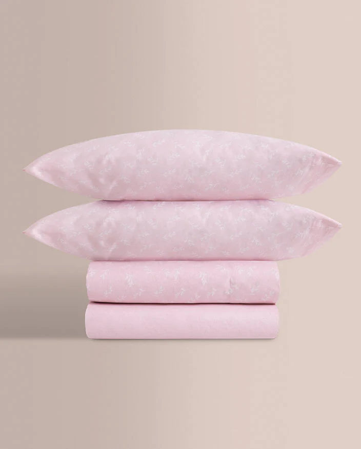 Pack completo de sábanas 100% algodón rosa dobladas con bajera y fundas.