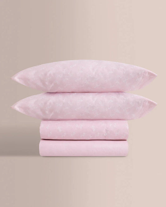 Pack completo de sábanas 100% algodón rosa dobladas con bajera y fundas.